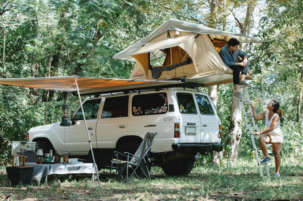 Couple camping in their overland road SUV