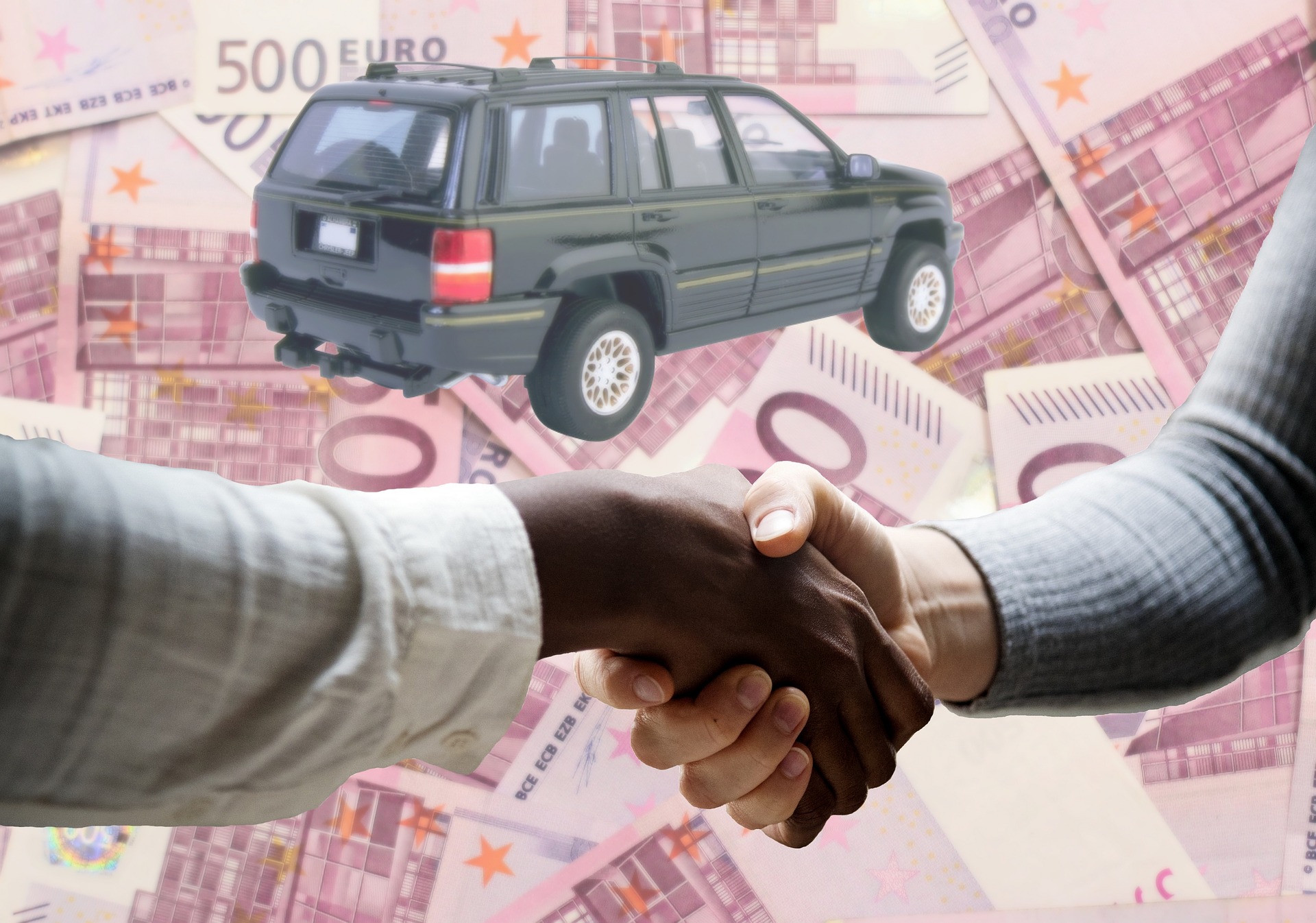 Buyers handshaking to purchase an SUV